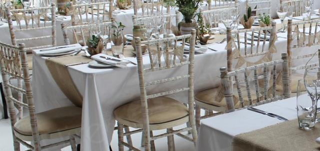 https://d1hcs5uofxldvl.cloudfront.net/chair-hire/article_additional/your-wedding-with-chair-hire8/your-wedding-with-chair-hire8-740x350.jpg - Hessian table runners bring out the Chiavaris' limewash finish.